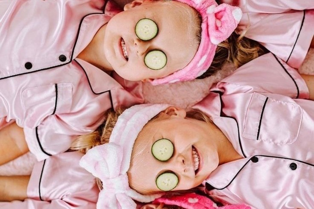 Children in matching pink pyjamas at a Polished Parties glam and spa party